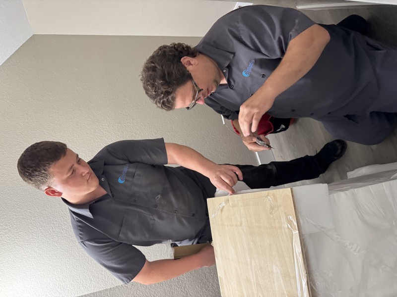 Two Coastline Plumbing technicians on the job in Orange County