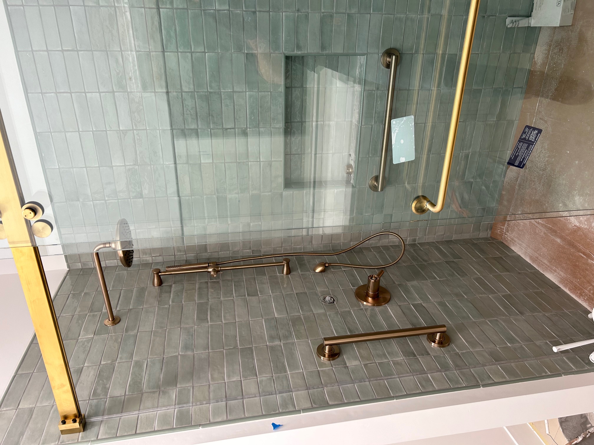 Custom tile shower with bronze fixtures